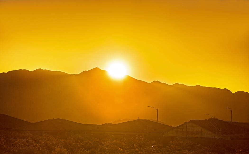 The sun rises in the northwest Las Vegas Valley on Wednesday, June, 5, 2019, in Las Vegas. The ...