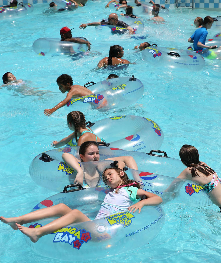 People cool off as they play in the Surf-A-Rama Wave Pool at Cowabunga Bay Water Park in Hender ...