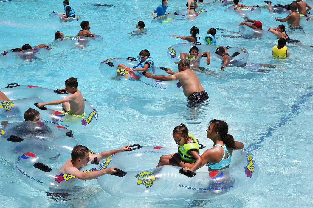 People cool off as they play in the Surf-A-Rama Wave Pool at Cowabunga Bay Water Park in Hender ...