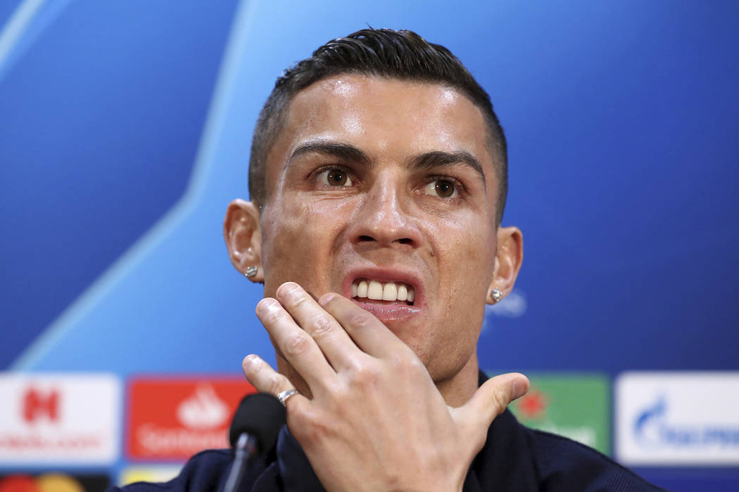 Cristiano Ronaldo attends a press conference at Old Trafford, Manchester, England, Oct. 22, 201 ...