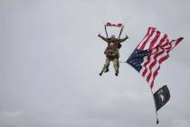 U.S. World War II D-Day veteran Tom Rice, from Coronado, CA, parachutes in a tandem jump into a ...