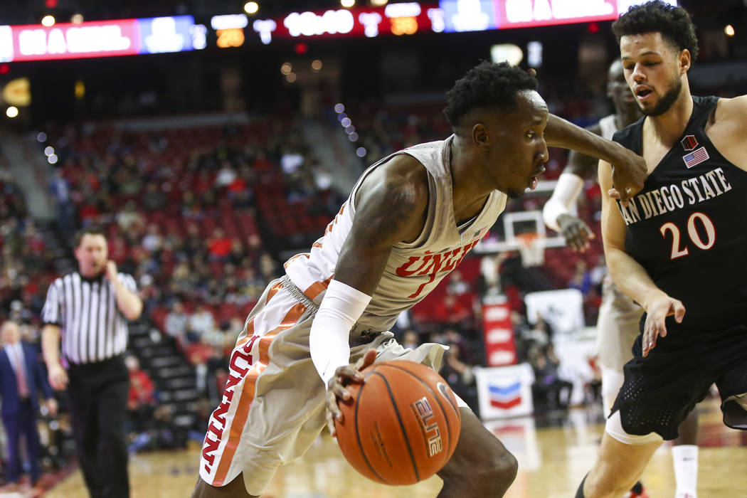 UNLV Rebels guard Kris Clyburn (1) moves the ball around San Diego State Aztecs guard Jordan Sc ...