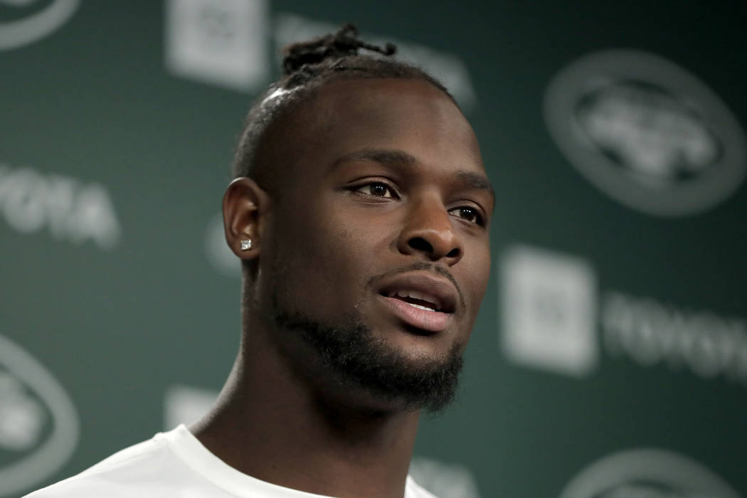 In this Tuesday, June 4, 2019, photo, New York Jets running back Le'Veon Bell speaks to report ...