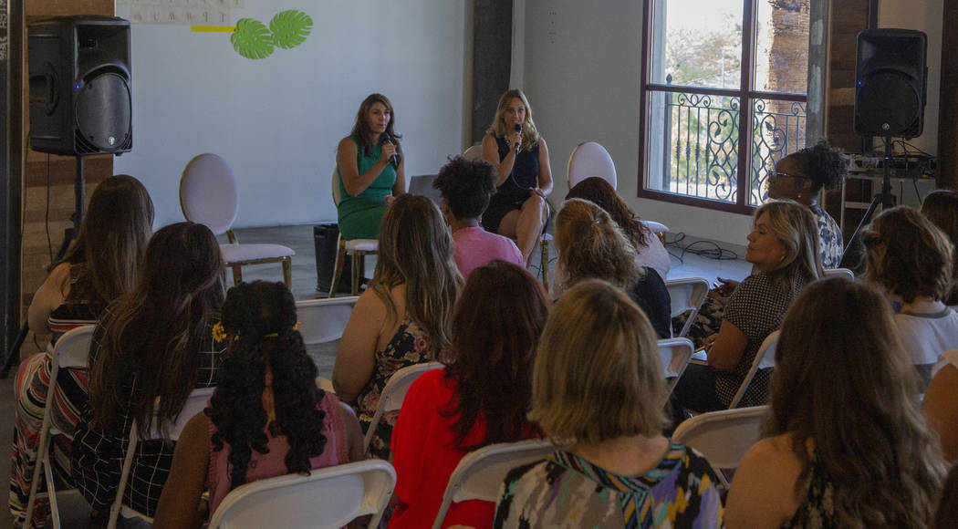 Attendees listen to speakers Paola Armeni, left, and Jaime Kobzelman during the Manifest Summit ...