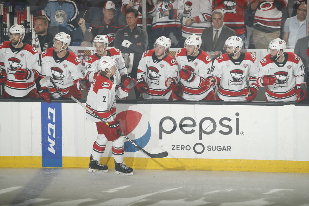 Charlotte Checkers defenseman Jake Bean (2) celebrates his goal with teammates in the second pe ...