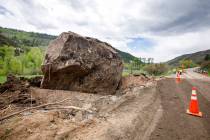 FILE - In this May 27, 2019 file photo, an 8.5 million pound boulder rests next to Colorado Sta ...
