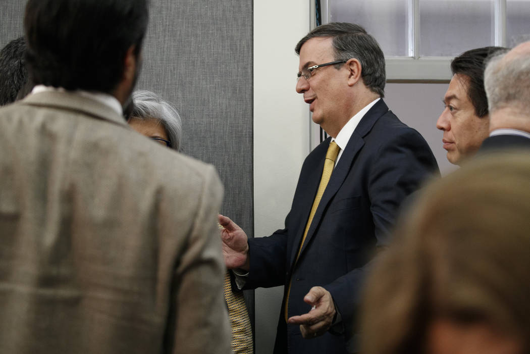 Marcelo Ebrard, Mexico's Secretary of Foreign Affairs, passes reporters as he leaves a news con ...