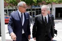 Carnival Corp. President Arnold Donald, left, arrives at federal court, Monday, June 3, 2019, i ...
