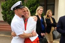 Navy Special Operations Chief Edward Gallagher, left, hugs his wife, Andrea Gallagher, after le ...