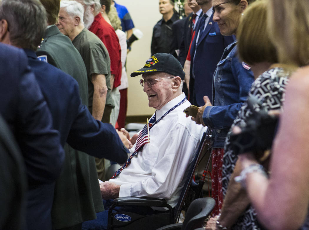 World War II veteran William Dunsmore reacts after leading the Pledge of Allegiance during a ce ...