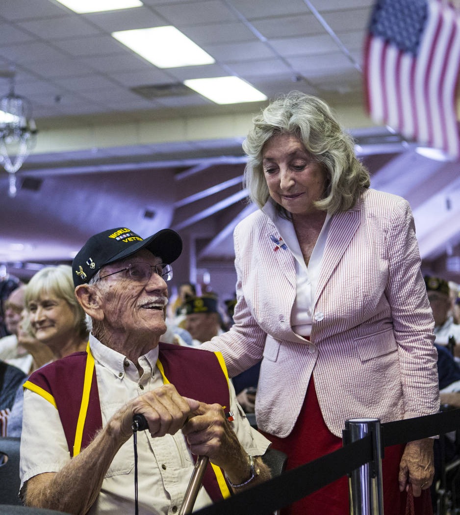 World War II veteran Dean Whitaker, 94, left, talks with U.S. Rep. Dina Titus, D-Nev., before t ...