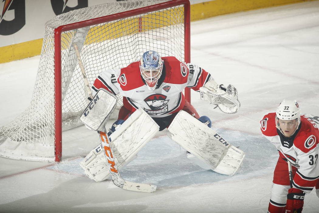 Charlotte Checkers goaltender Dustin Tokarski defends the net in the second period of Game 4 of ...