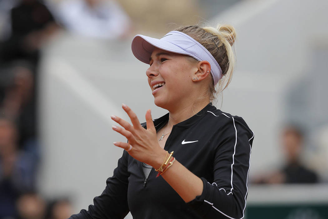 Amanda Anisimova of the U.S. reacts after missing a shot against Australia's Ashleigh Barty dur ...