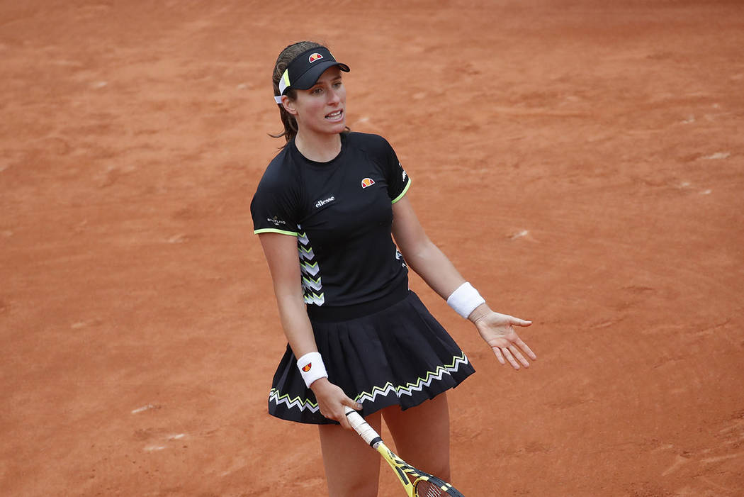 Britain's Johanna Konta reacts after missing a shot against Marketa Vondrousova of the Czech Re ...