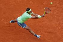 Spain's Rafael Nadal plays a shot against Switzerland's Roger Federer during their semifinal ma ...