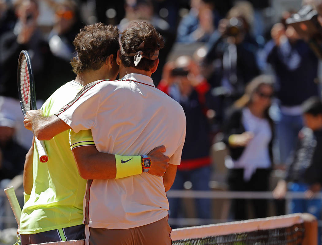 Spain's Rafael Nadal, right, is congratulated by Switzerland's Roger Federer after winning thei ...