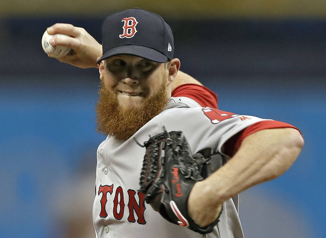 In this March 31, 2018, file photo, Boston Red Sox relief pitcher Craig Kimbrel delivers to the ...