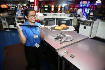 Canyon Springs High School graduate Angelica Tariman, 17, works in the kitchen at the Las Vegas ...