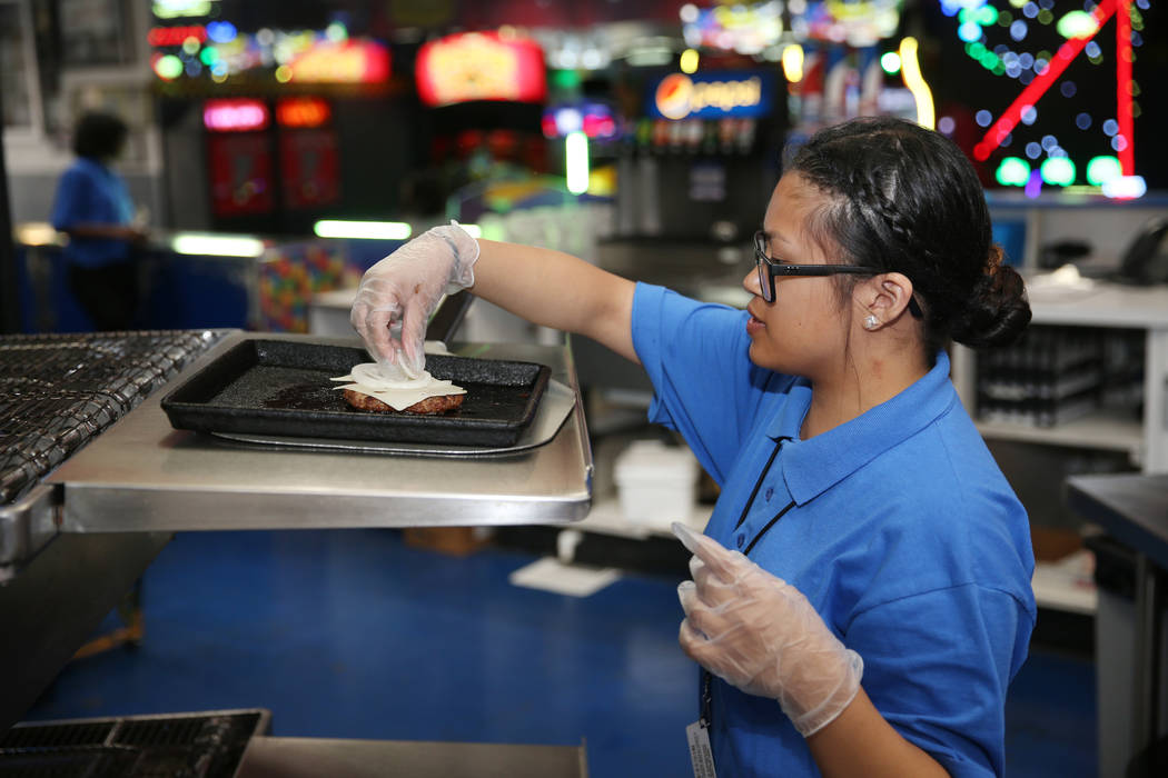 Canyon Springs High School graduate Angelica Tariman, 17, works in the kitchen at the Las Vegas ...