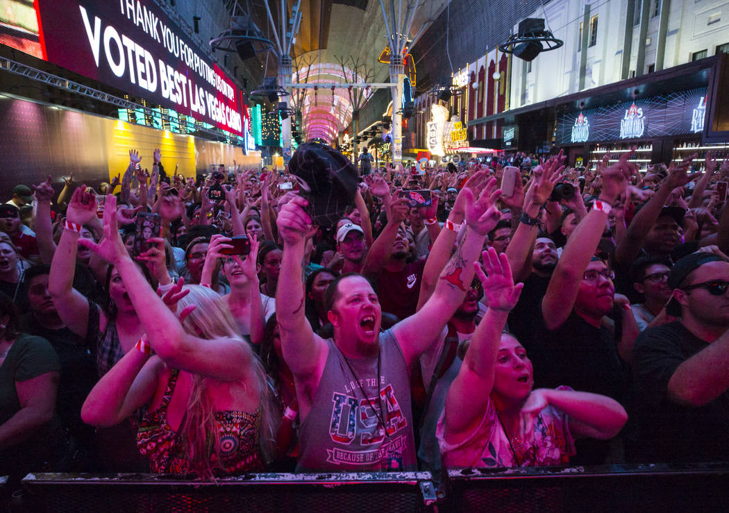 Fans cheer as Steve Aoki performs on the Main Street Stage at the Fremont Street Experience aft ...