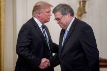President Donald Trump and Attorney General William Barr shake hands during a Public Safety Off ...