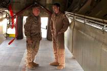 Marine Gen. Frank McKenzie, head of U.S. Central Command, confers with an Air Force officer bel ...