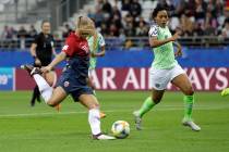 Norway's Lisa-Marie Utland, left, kicks the ball past Nigeria's Onome Ebi to score her team's s ...