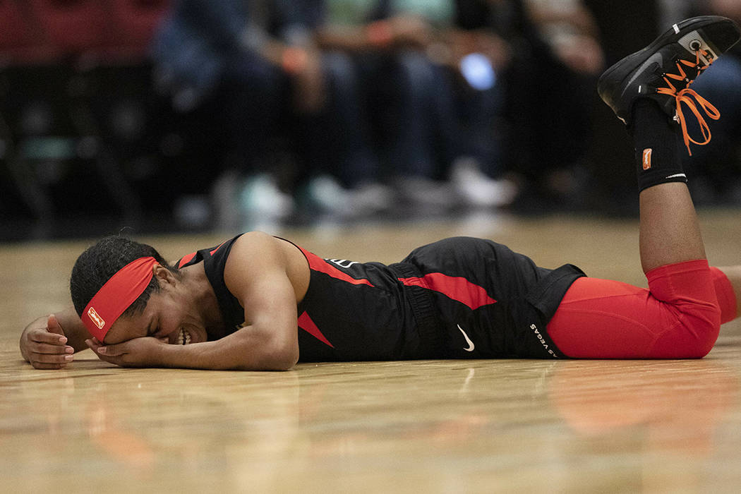 Las Vegas Aces' Sydney Colson lies on the court after being injured in the first quarter of a W ...