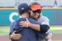 Kaden Manczuk, right, hugs San Antonio Missions pitcher Bubba Derby after Manczuk threw out the ...