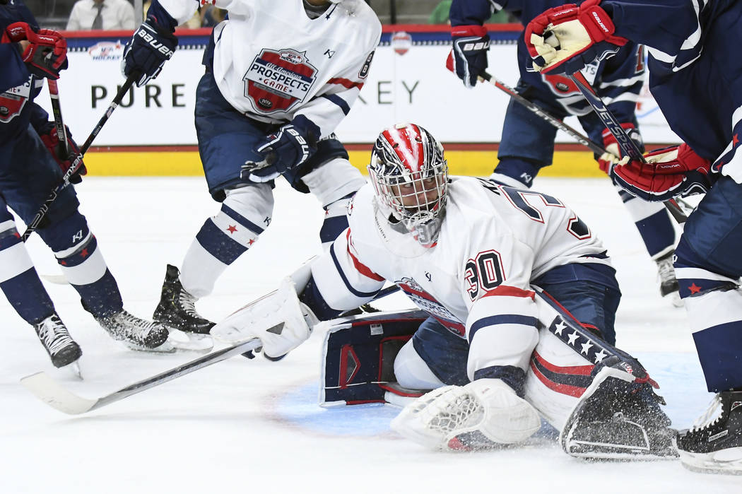 Team Langenbrunner goalie Spencer Knight (30) kicks the puck into the corner during the USA Hoc ...