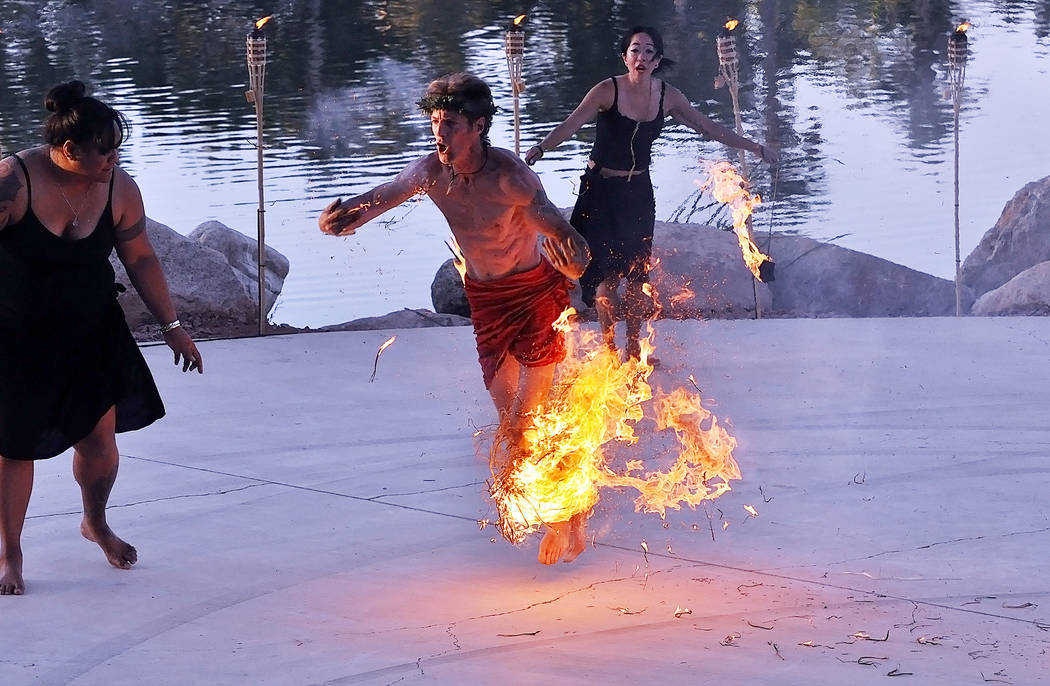 A fire dancer's costume catches fire while performing at a luau outside the Lakeside casino in ...