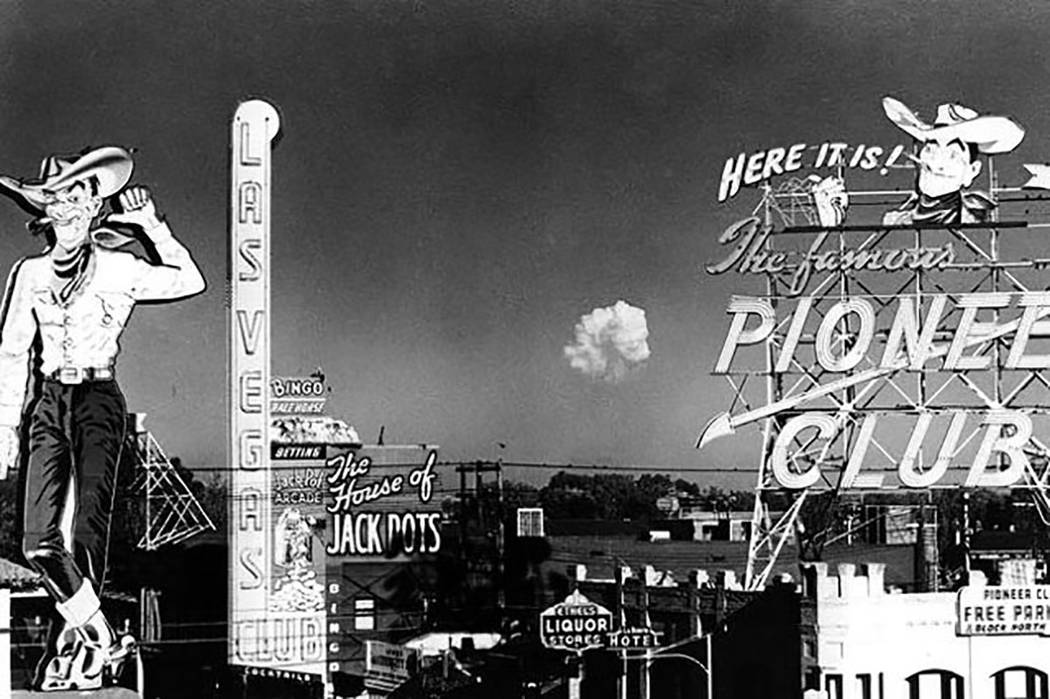 In this November 1951, Las Vegas News Bureau file photo, a mushroom cloud expands above the des ...
