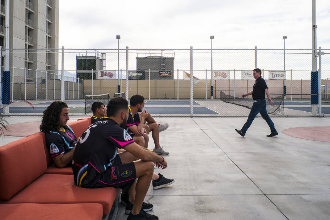 Brett Lashbrook, owner and CEO of Lights FC, right, walks past players as he helps set up for t ...