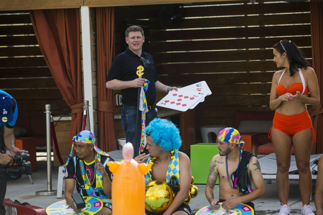 Brett Lashbrook, owner and CEO of Lights FC, holds props while preparing for his team's photo s ...