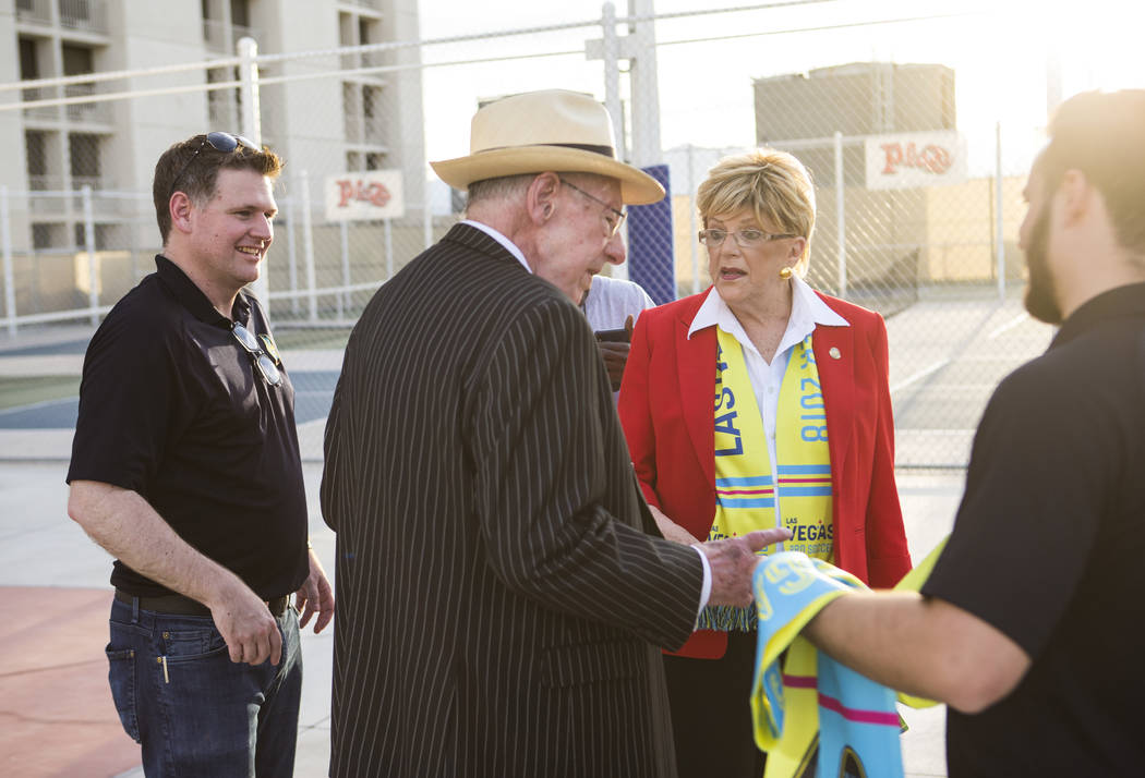 Brett Lashbrook, owner and CEO of Lights FC, left, talks with Mayor Carolyn Goodman, center rig ...