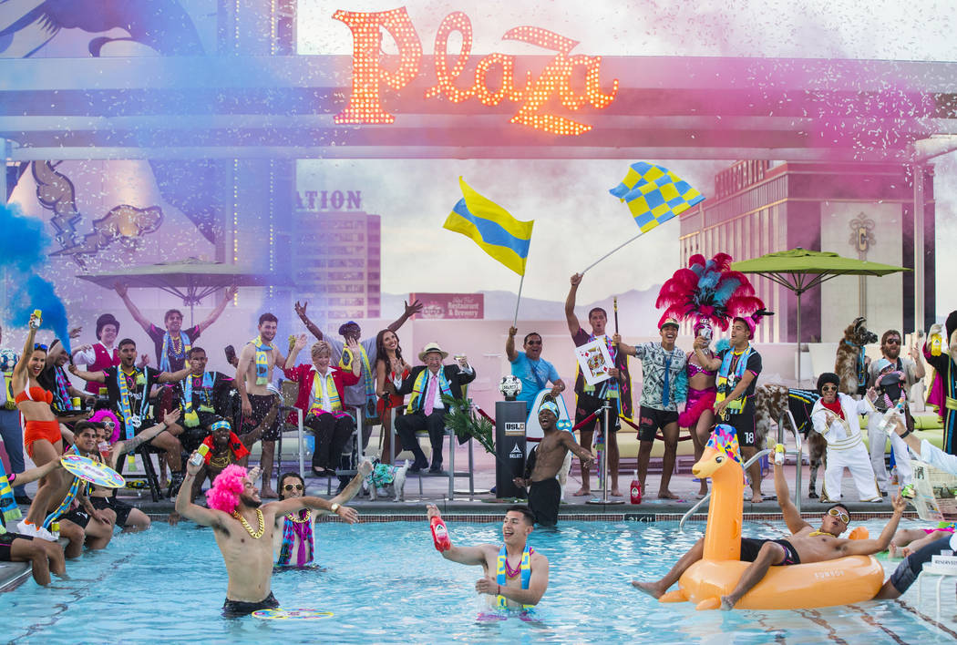 Players and special guests pose for the Lights FC team photo shoot at the Plaza in Las Vegas on ...