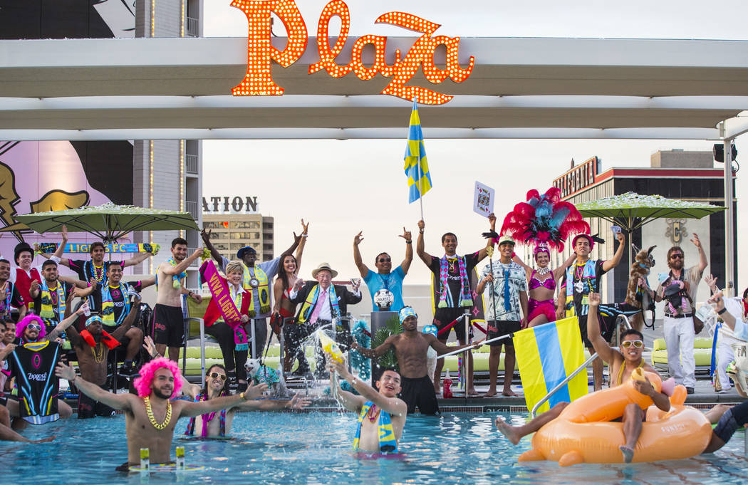 Players and special guests pose for the Lights FC team photo shoot at the Plaza in Las Vegas on ...