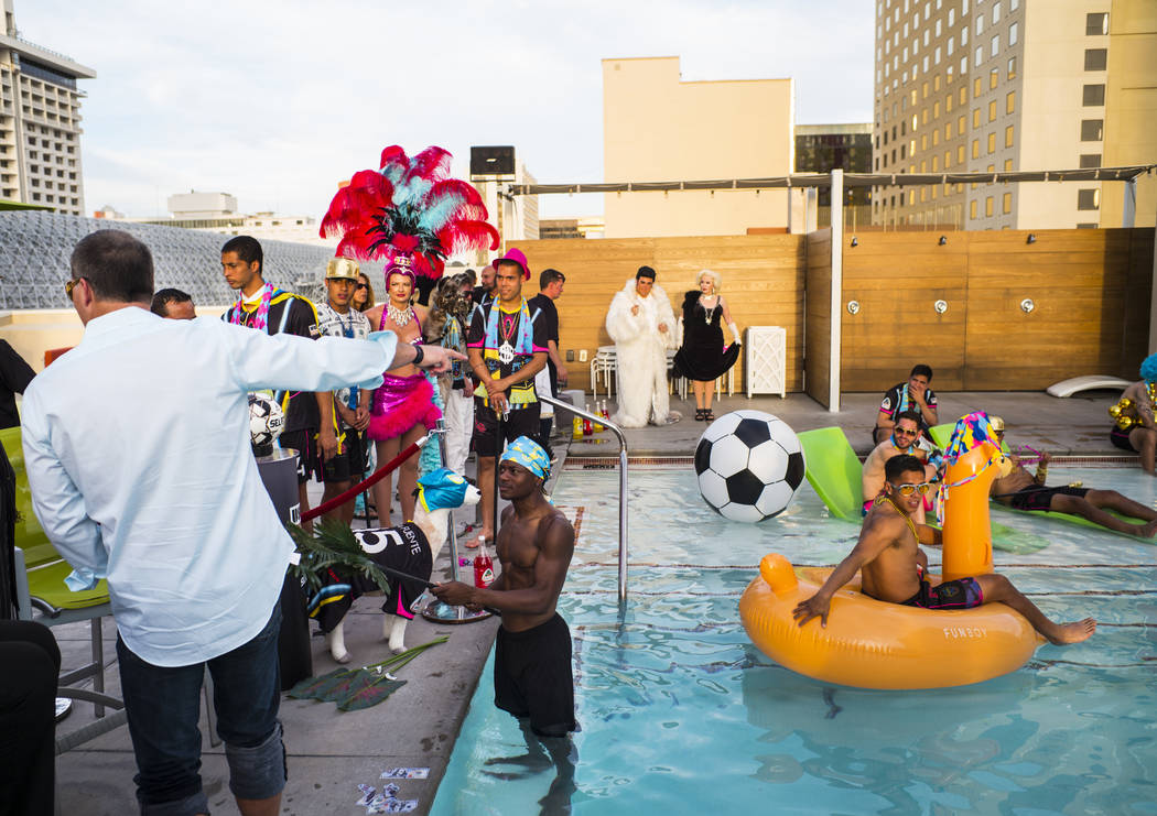 Lights FC players and others prepare for the team's photo shoot at the Plaza in Las Vegas on Tu ...