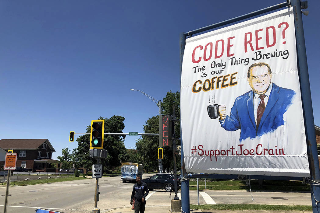 A sign supporting Springfield meteorologist Joe Crain appears at Grab a Java, a drive-through c ...