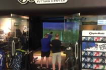 Golfers swing and observe in the state-of-the-art hitting bay at Las Vegas Golf Superstore, whi ...