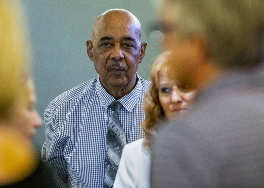 Plaintiff German Ortiz and his wife, Angela, stand as the jury enters the courtroom at the Regi ...
