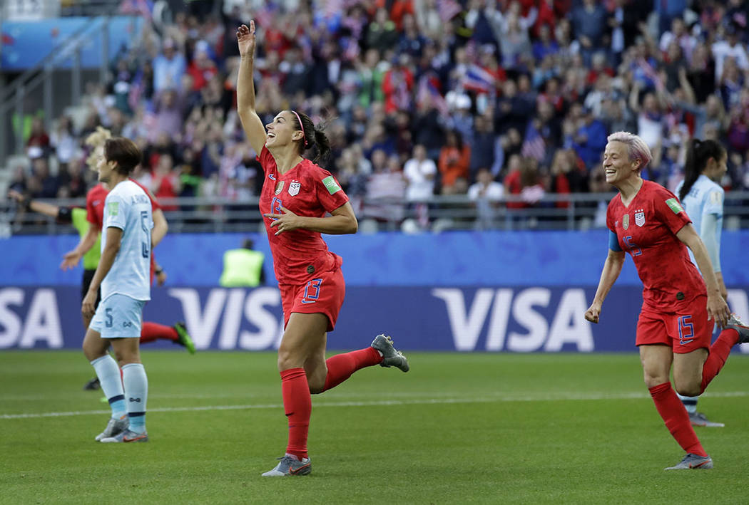 United States' Alex Morgan, left, celebrates after scoring the opening goal during the Women's ...