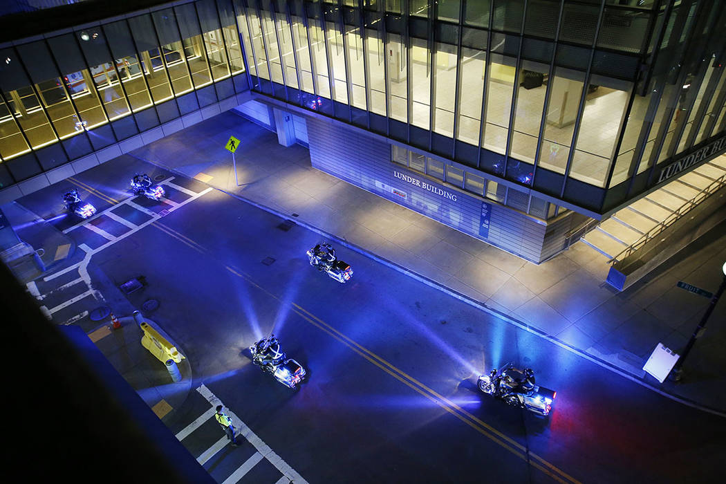 A police motorcade for the ambulance carrying David Ortiz arrives at Mass General Hospital in B ...