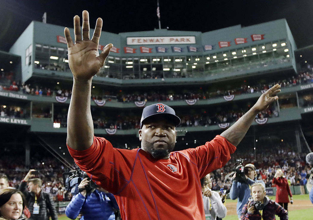 In this Oct. 10, 2016, file photo, Boston Red Sox's David Ortiz waves from the field at Fenway ...
