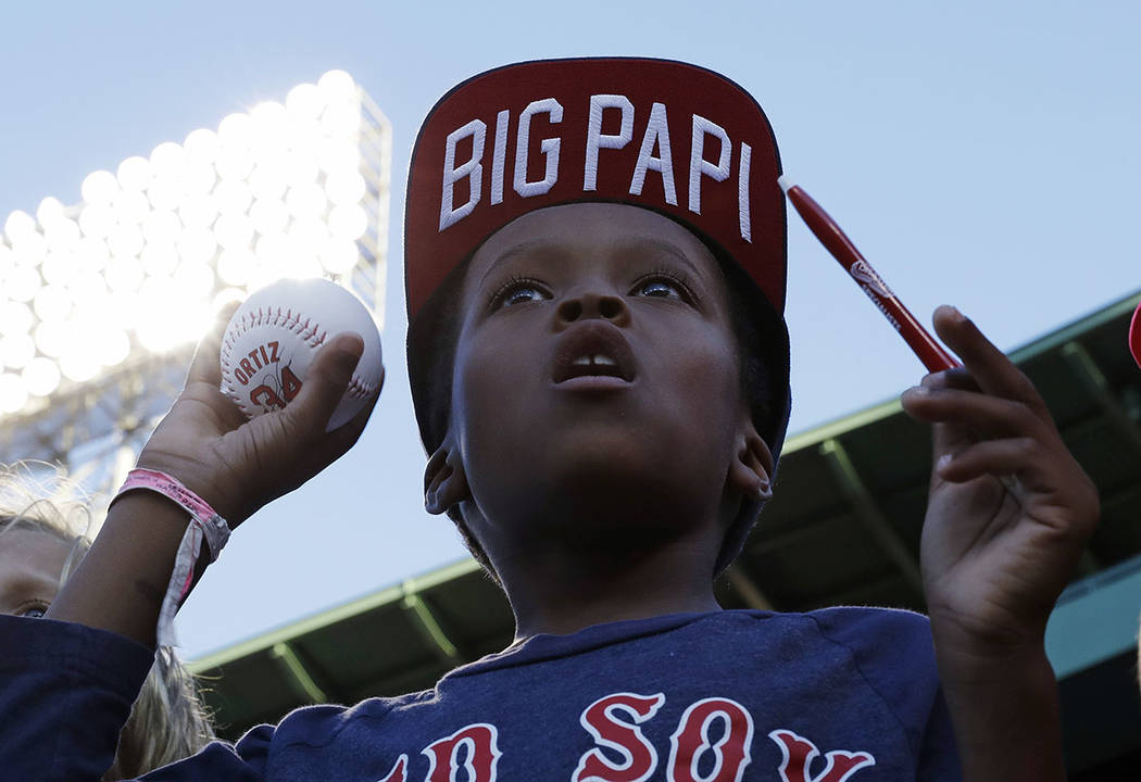 In this Aug. 29, 2016, file photo, a fan of Boston Red Sox designated hitter David Ortiz hopes ...