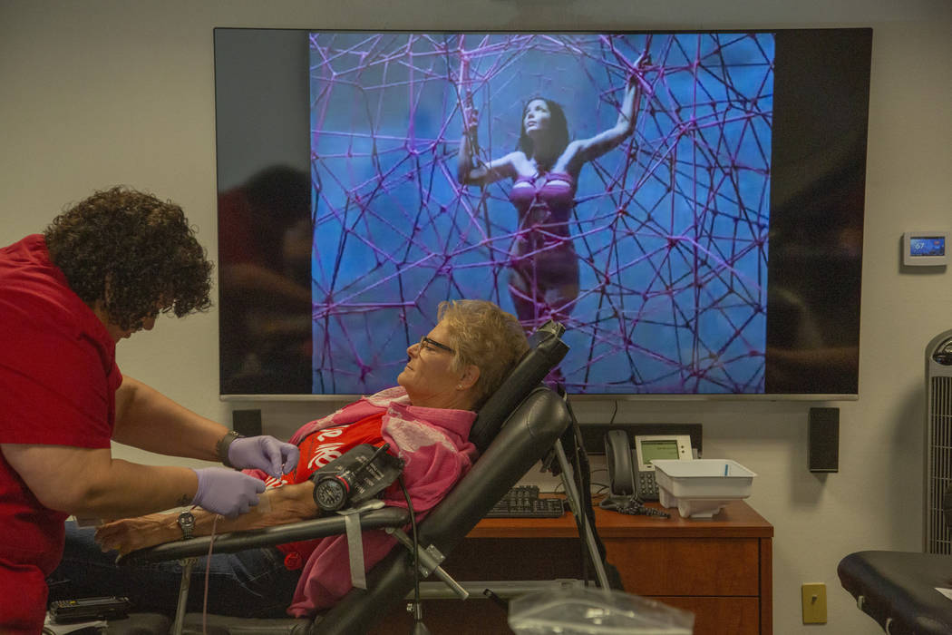 Marya Lebeau, 58, draws blood from Misty Jones, 30, from Toquerville, Utah, during the American ...