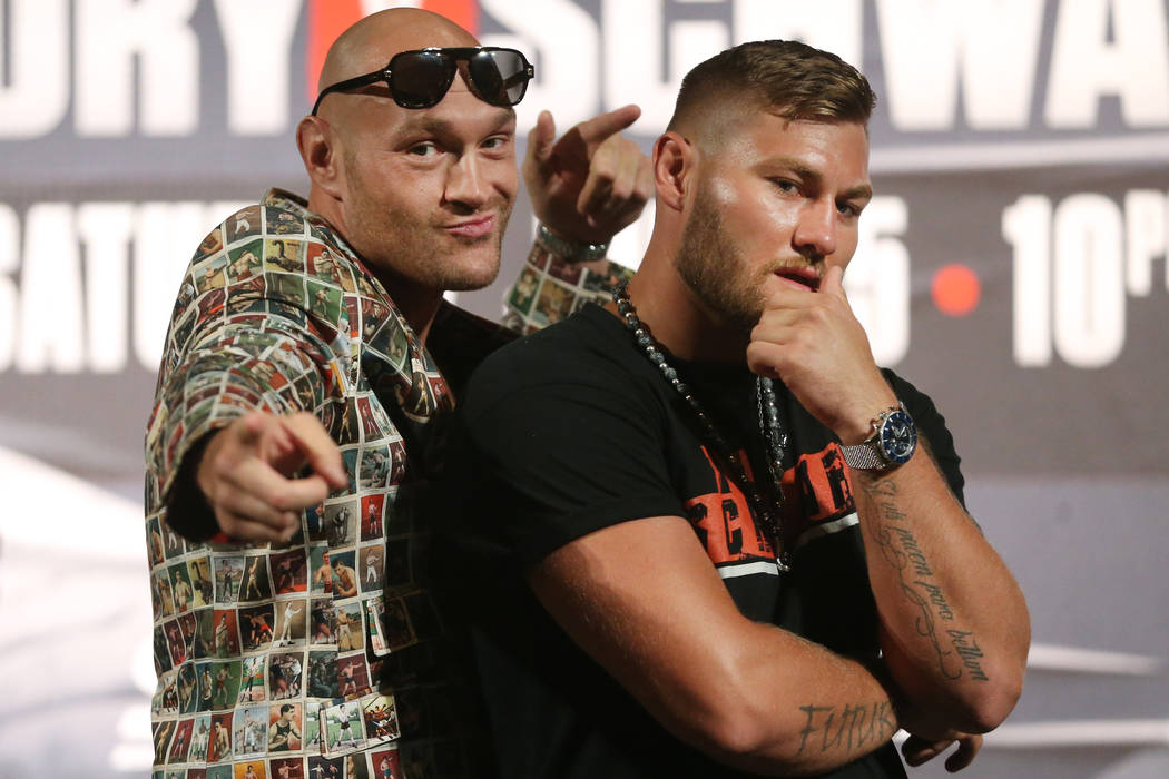 Tyson Fury, left, and Tom Schwarz, pose during their boxing press conference at the MGM Grand h ...