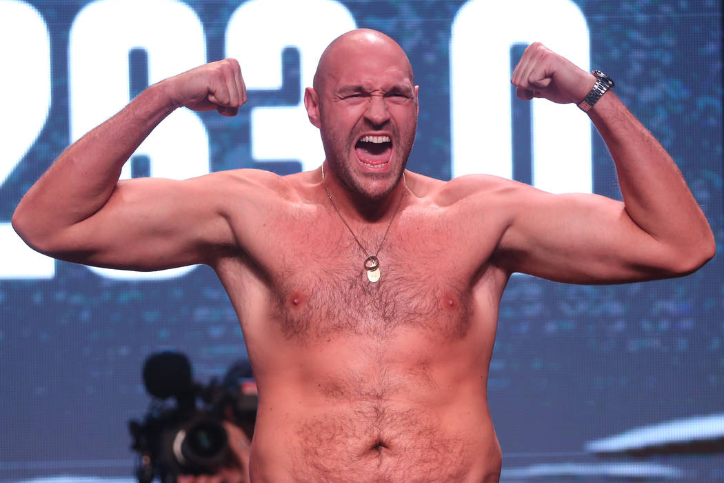 Tyson Fury poses during his weigh-in event at the MGM Grand Garden Arena in Las Vegas, Friday, ...