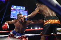 Jesse Hart, right, connects a punch against Sullivan Barrera in the light heavyweight bout at t ...