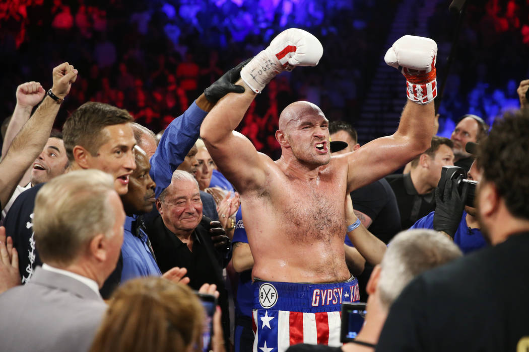 Tyson Fury celebrates his win against Tom Schwarz in the lineal heavyweight bout at the MGM Gra ...